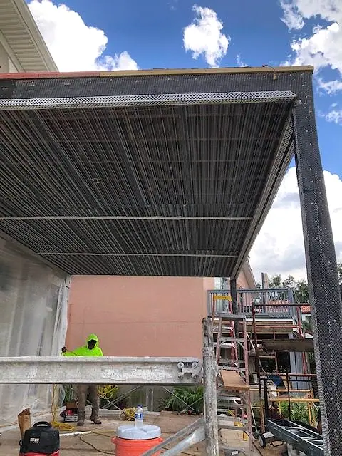 Balcony structure being rebuilt with new steel decking