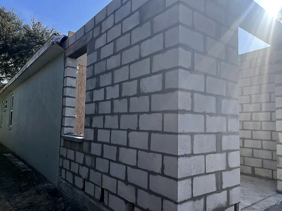 New concrete block wall with a window opening