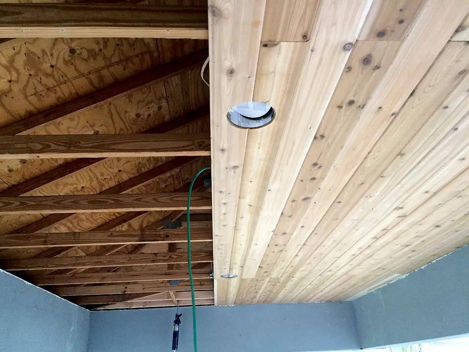 Cedar tongue-and-groove porch ceiling partly installed