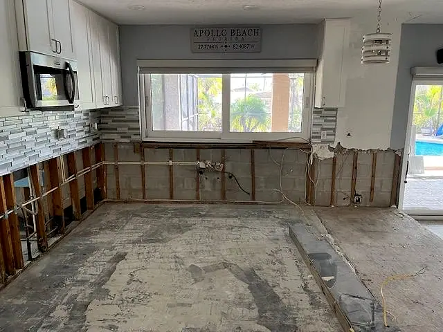 Kitchen stripped of damaged cabinets, wall board and flooring