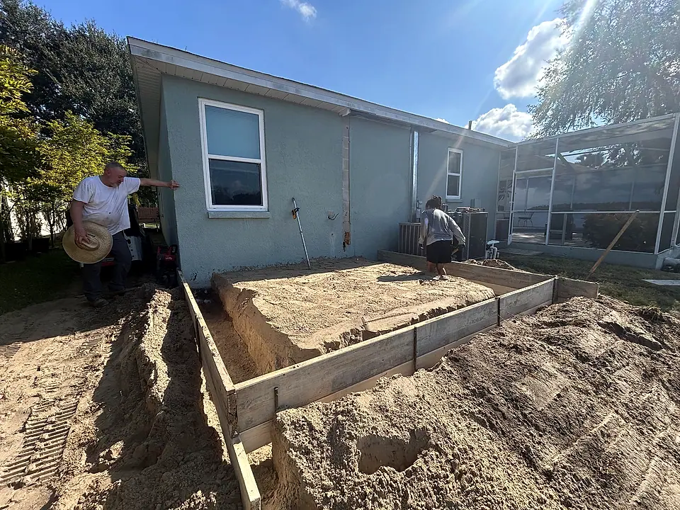 Crew forming footings for a home addition