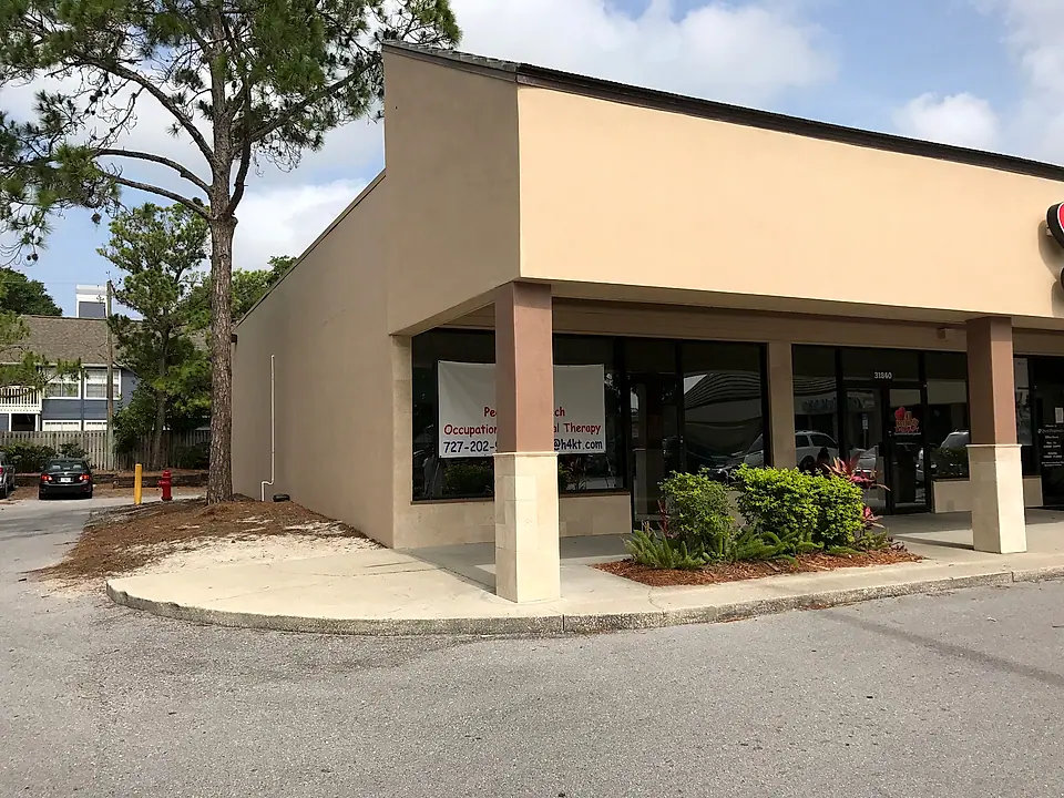 The repaired building corner with columns and stucco finished