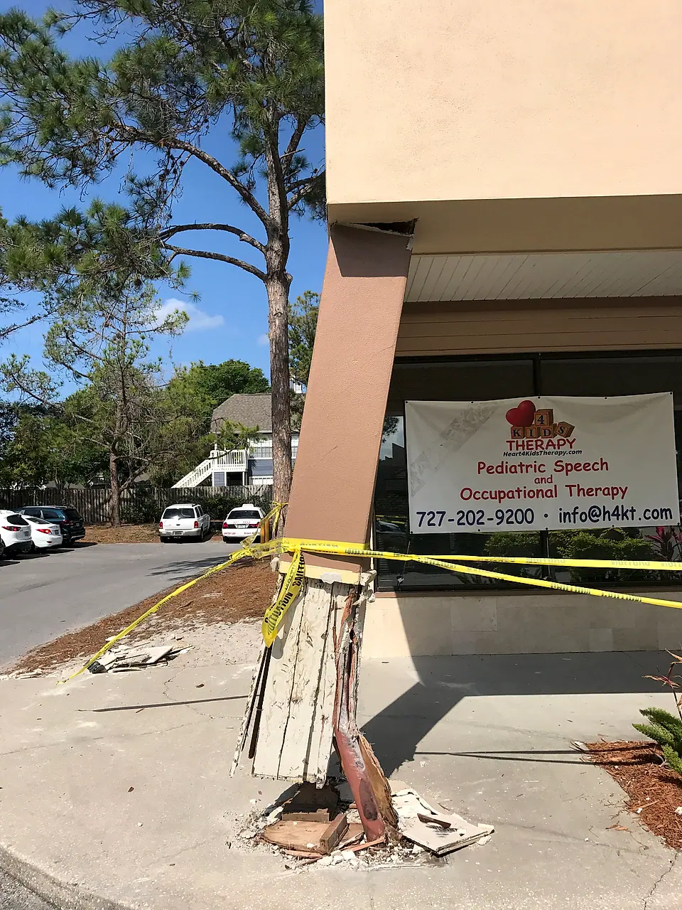 Storefront column crushed by a vehicle and taped off