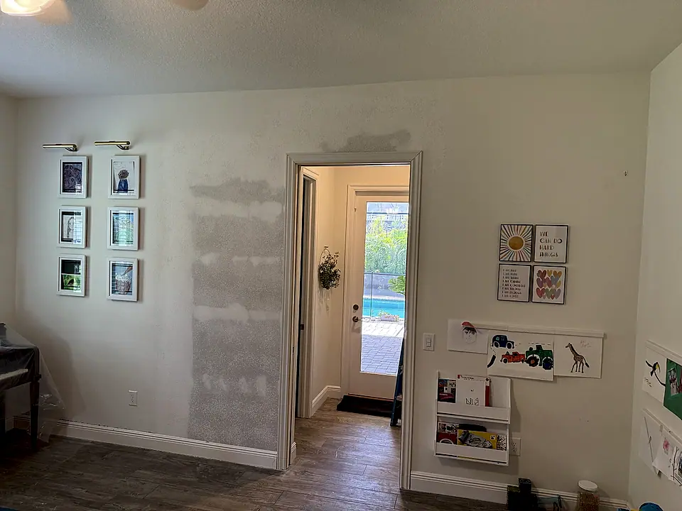 New drywall hung and taped where the wall was opened