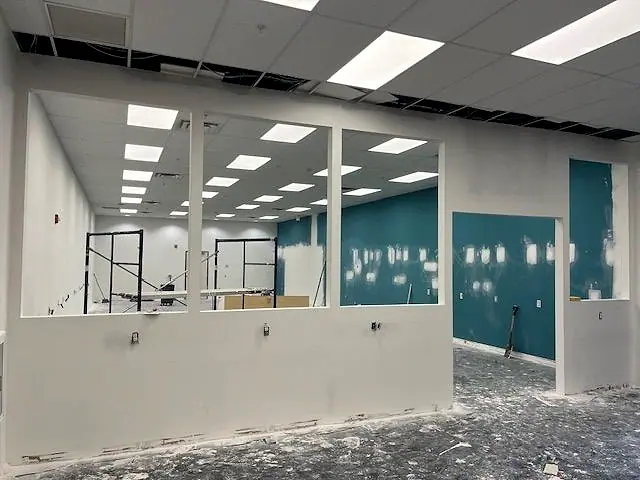 Office build-out with new drywall, glass openings and an accent wall