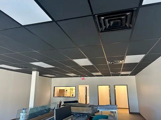 Finished office with a new ceiling grid, lighting and flooring