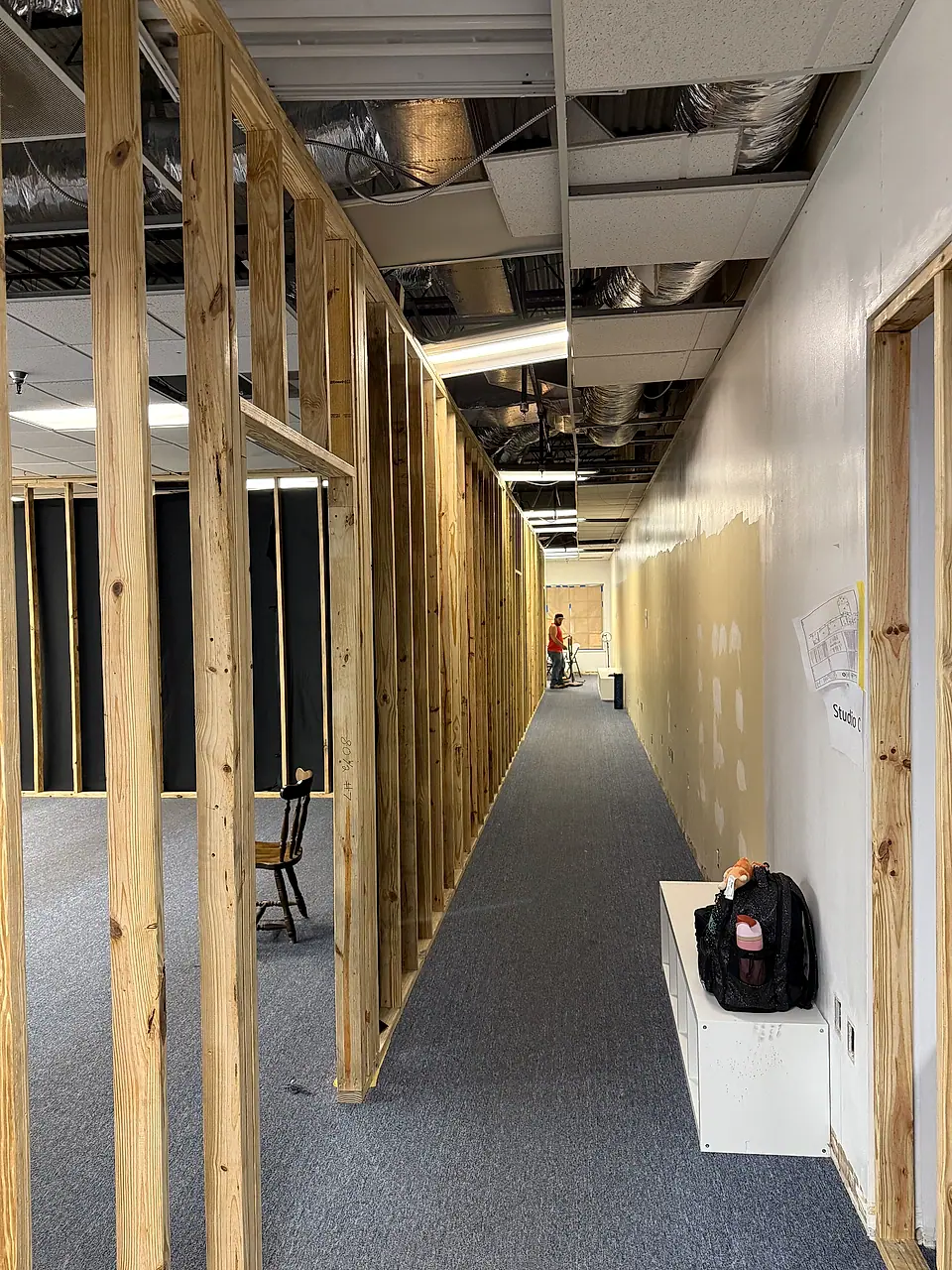 New office walls framed along a corridor