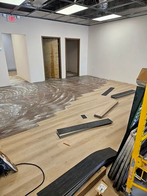 Luxury vinyl plank flooring going down in an office suite