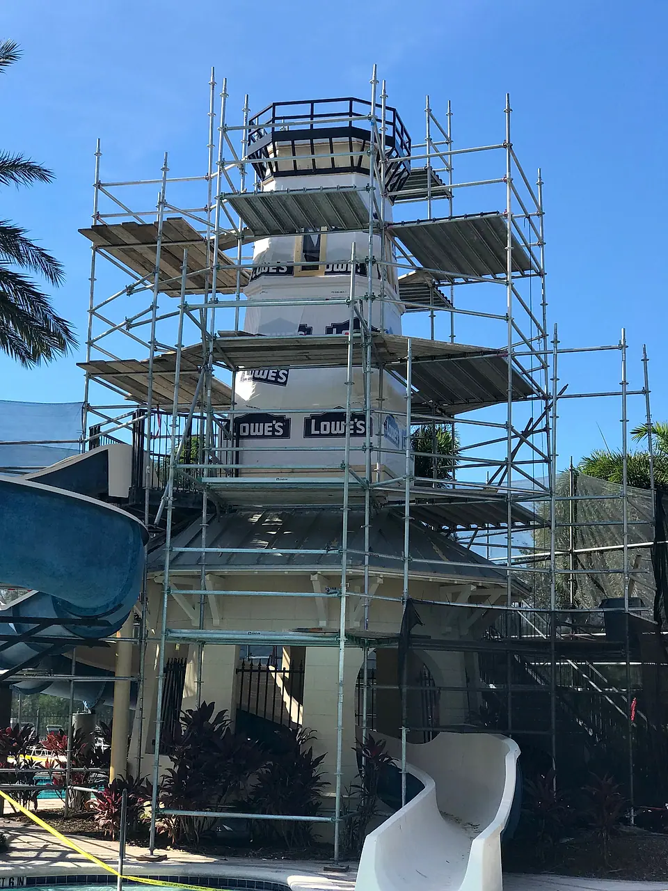 Full scaffolding on the lighthouse tower beside the slide