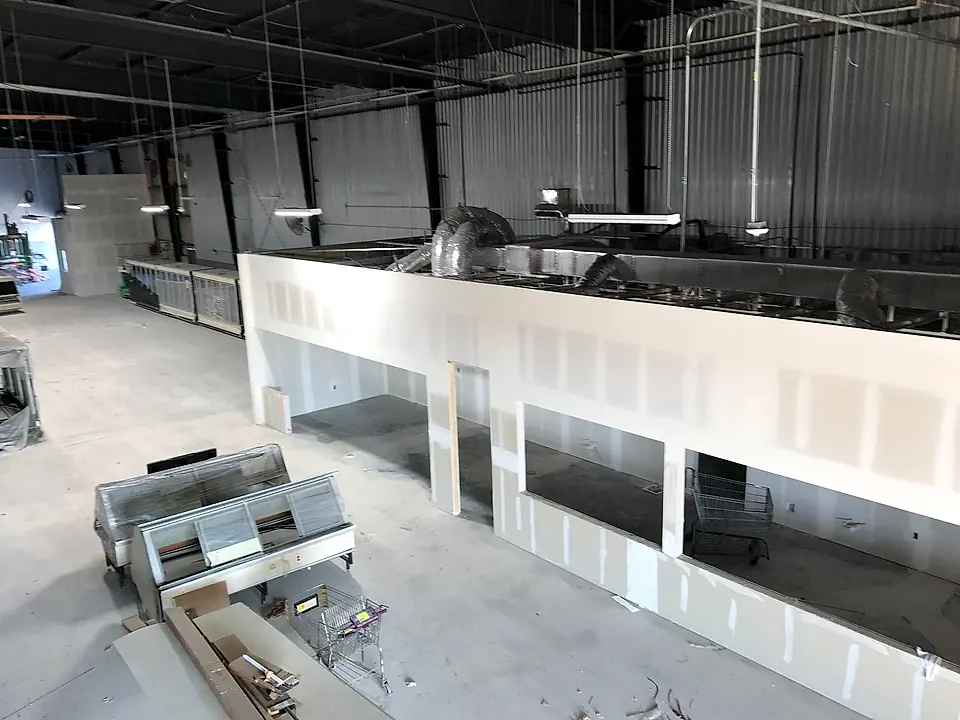 Commercial kitchen walls going up inside a warehouse space